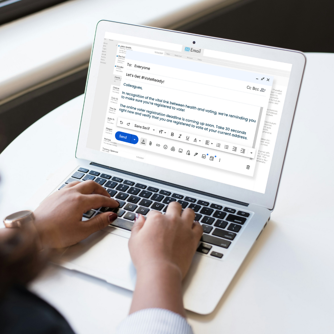 Person with the voter registration reminder email template open on their laptop