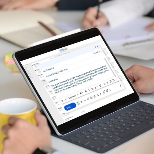 Person with coffee mug and tablet displaying the Vote Early Day template