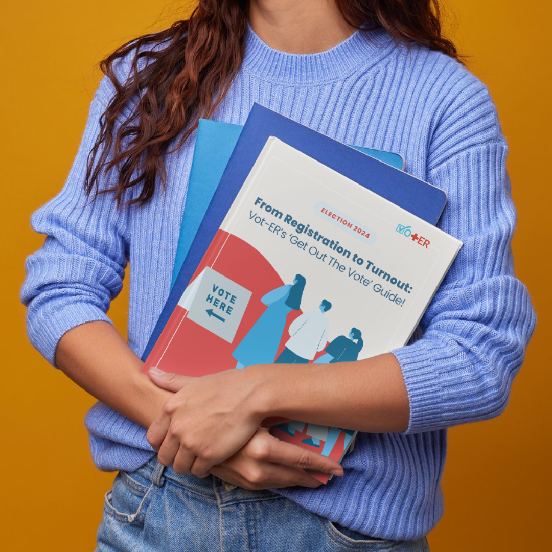 Person holding a stack of folders, with the Vot-ER Get Out the Vote Guide on top