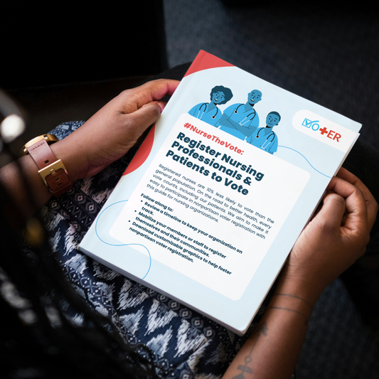 A person seated in a chair and holding the Hashtag Nurse The Vote Action Kit